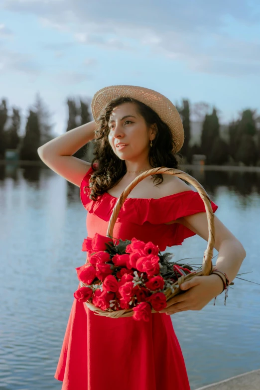 a young lady is holding a basket full of flowers