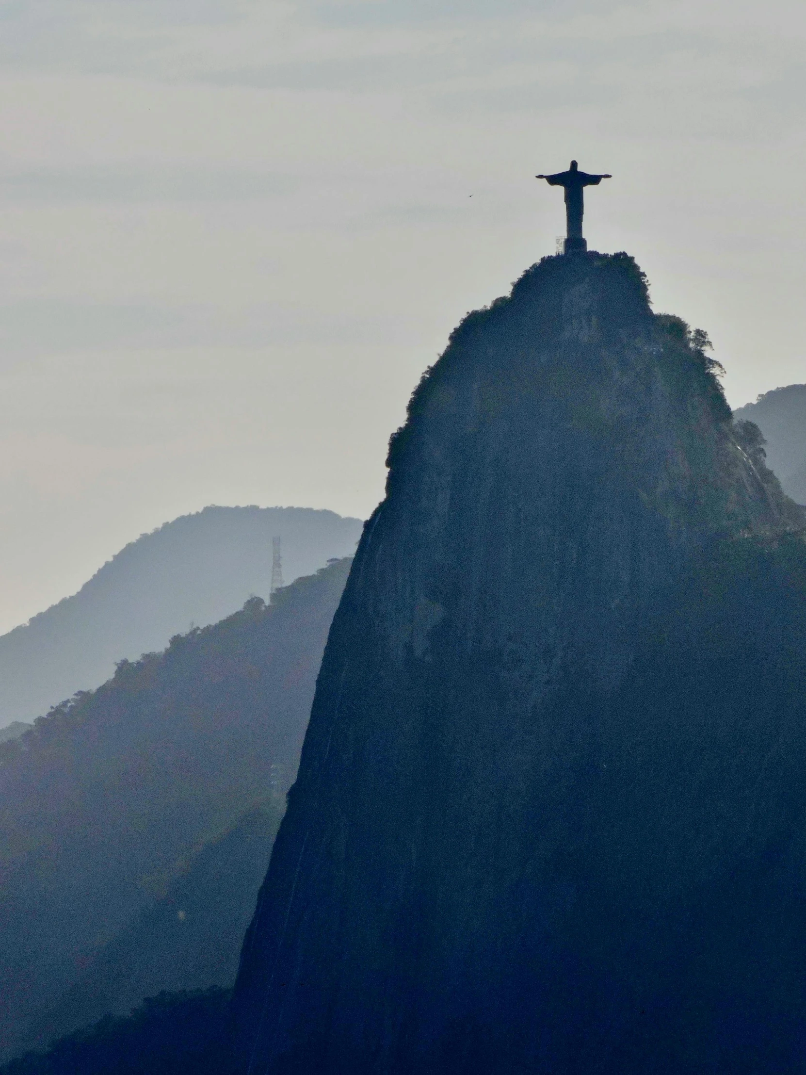 the christ statue on top of the hill