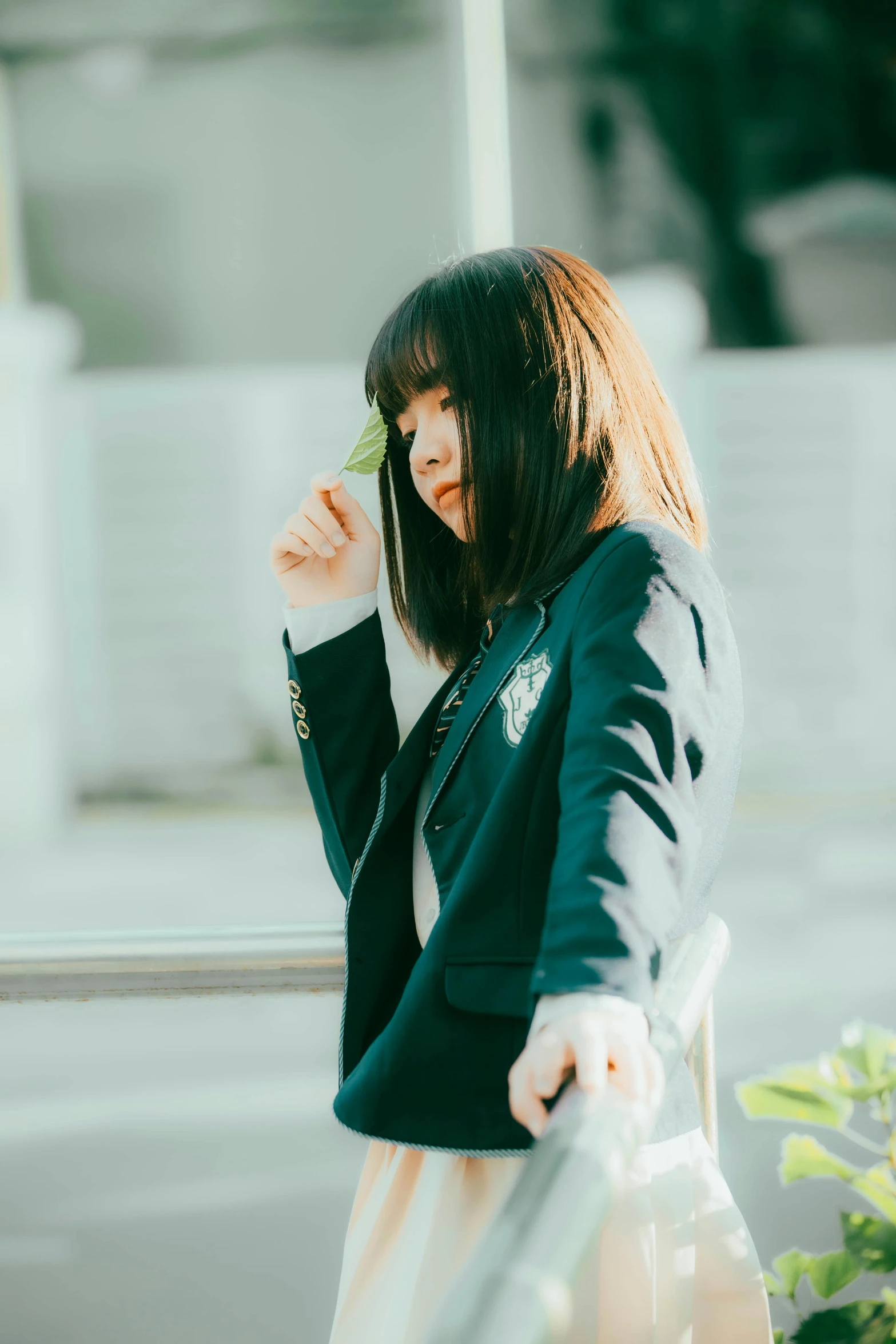 a woman in a suit on the phone