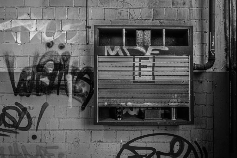 a black and white po of a bathroom with graffiti