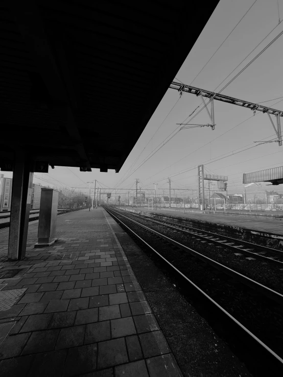 a train station that has several tracks in front of it