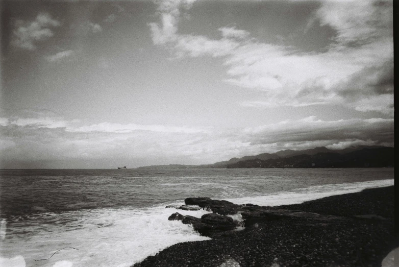 a black and white po of a beach