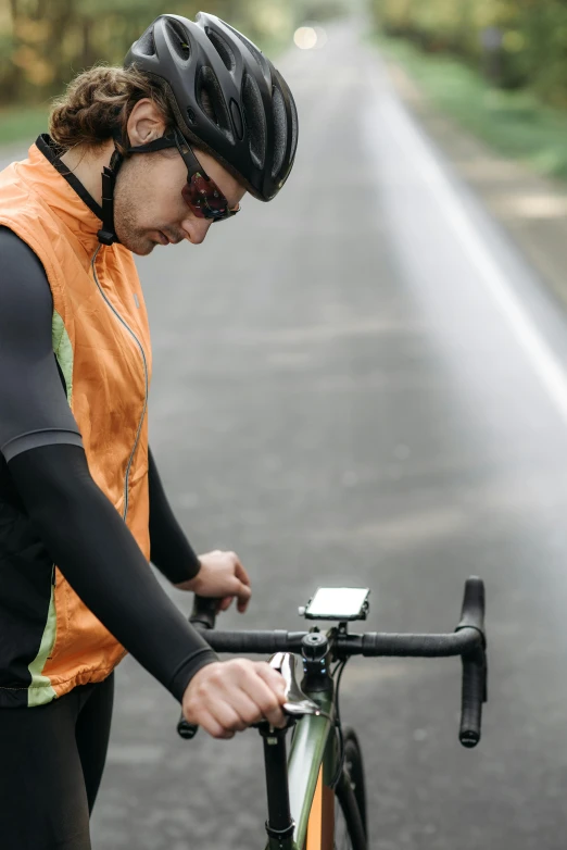 a person is checking their bike's speed in the street