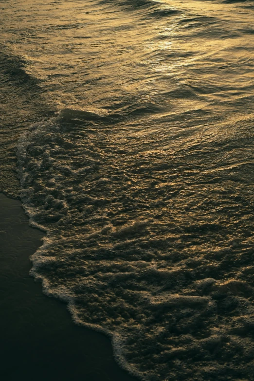 a surfboard in the surf of the ocean