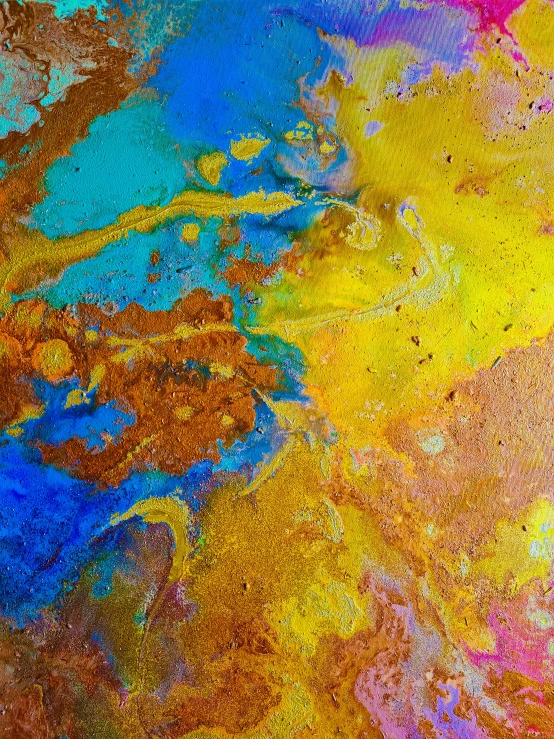 a paint covered piece of art is shown in vivid colors