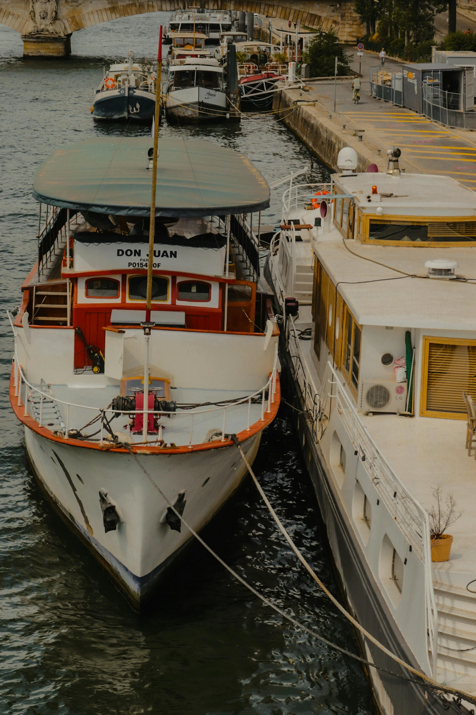 two boats are docked next to a boat ramp