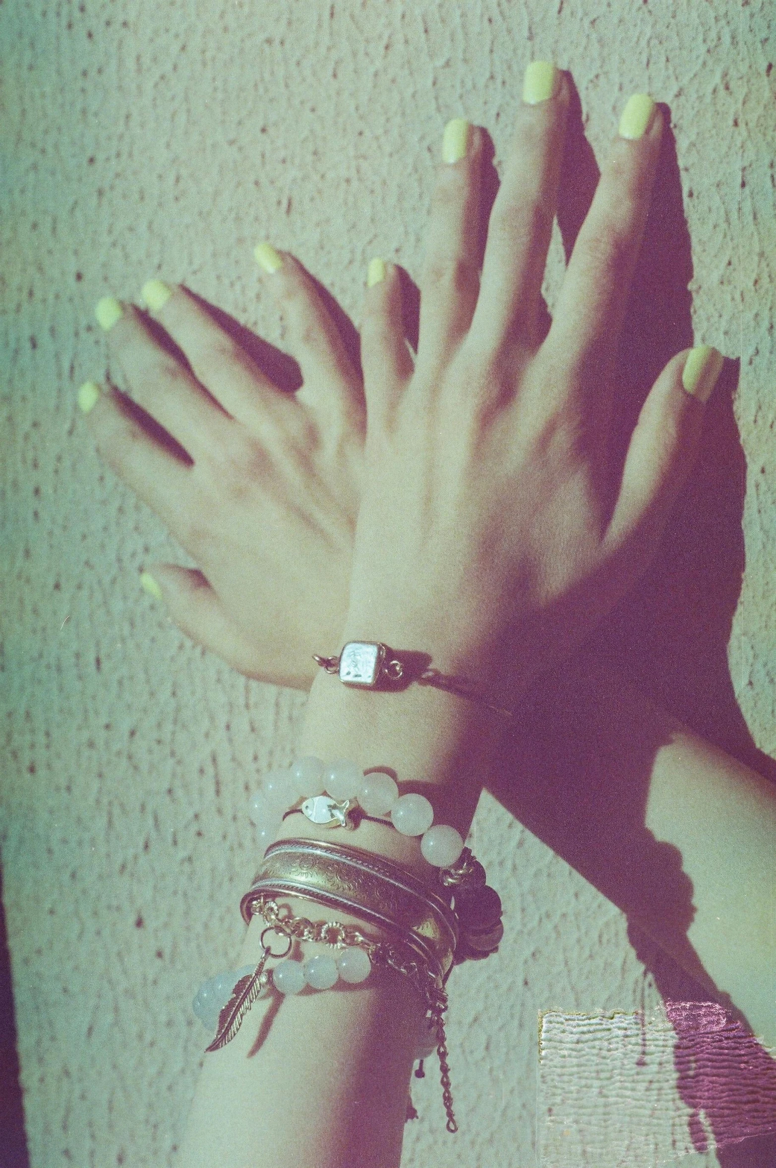 a woman's hands are holding onto several celets