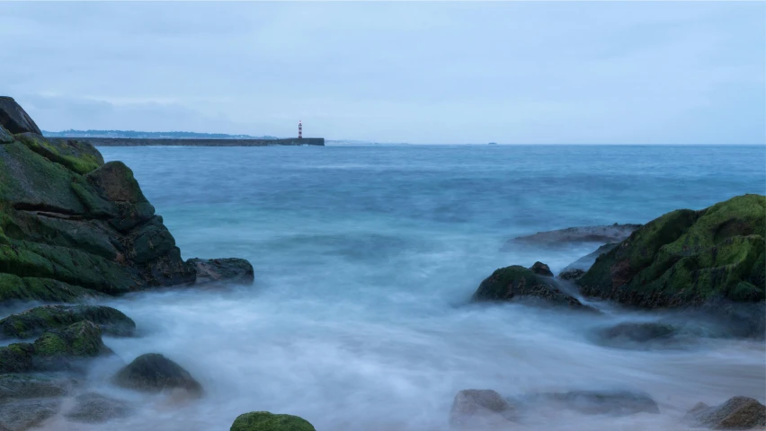 the water is lap high to the rocks and is surrounded by large rocks