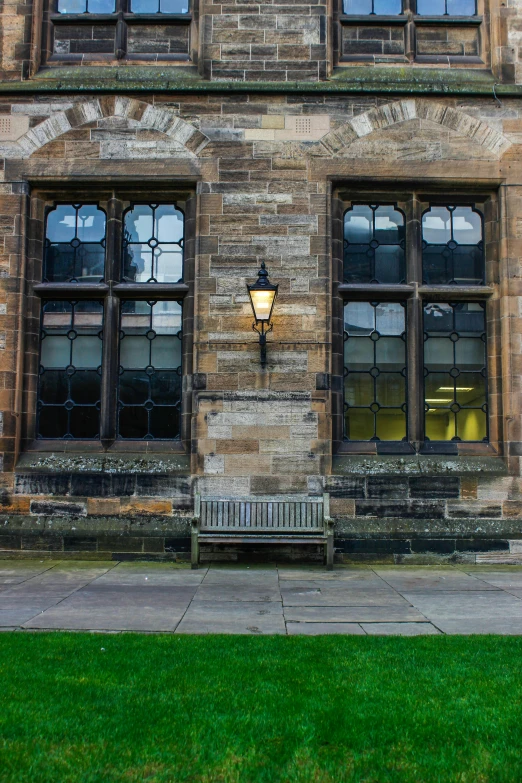 a stone building with a small bench outside