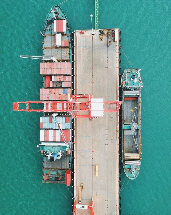 cargo ship in open water with orange gate