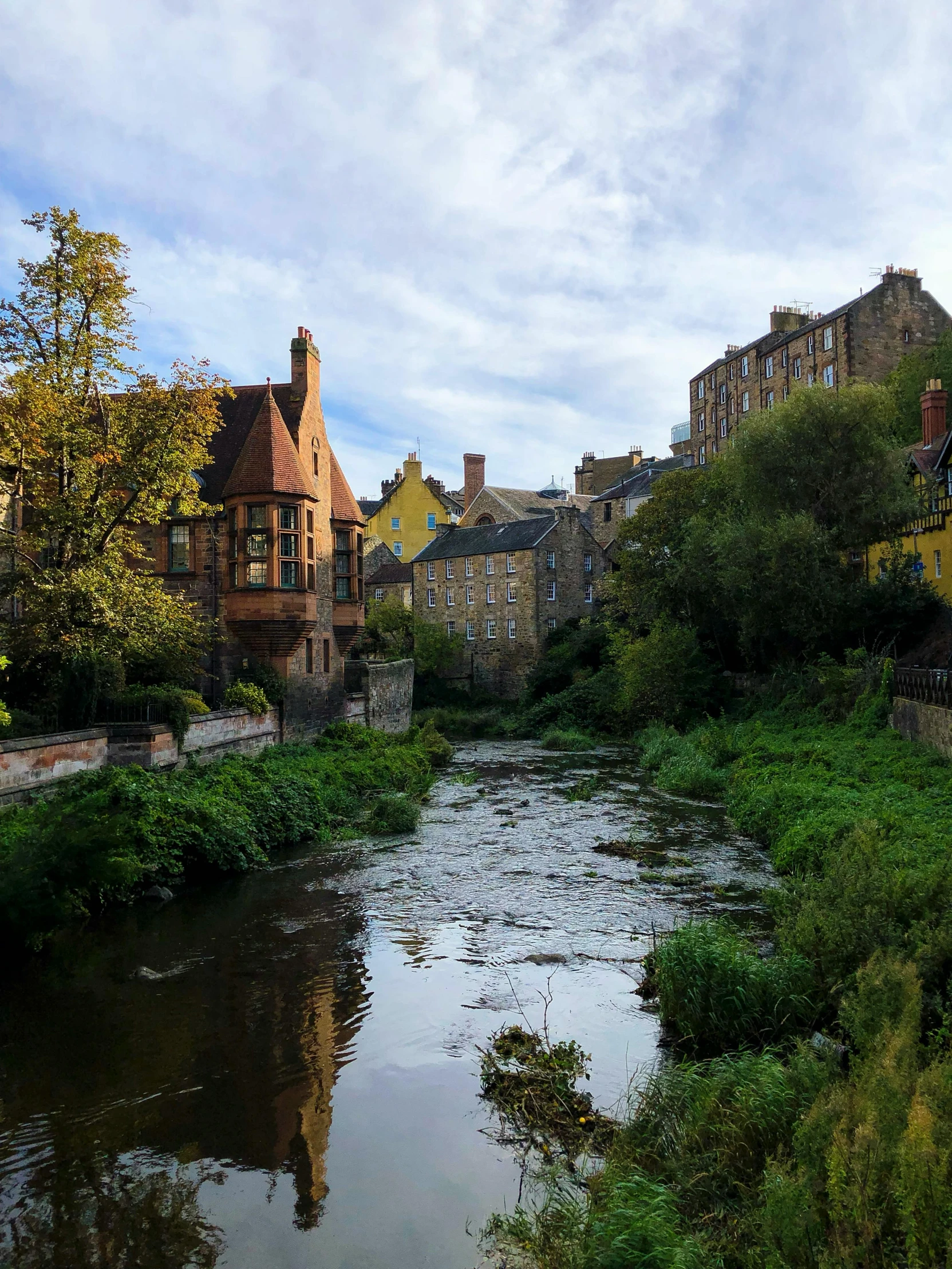 a river with several buildings on the side