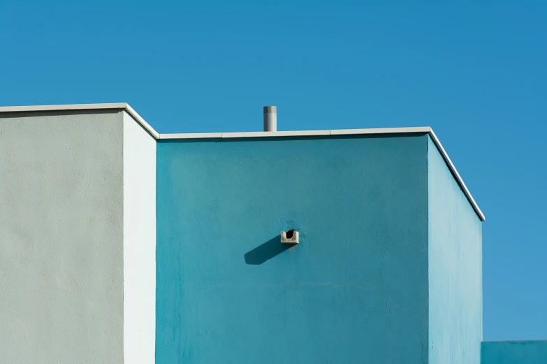 an open door to an old looking blue building