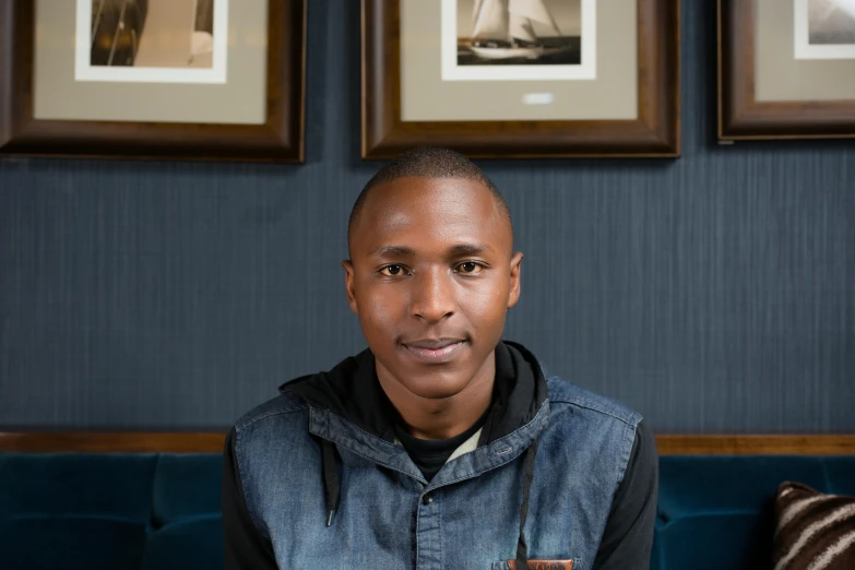 man wearing a jacket with sail boat prints above it