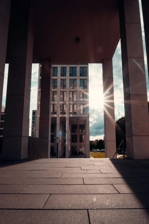 the sun shines on the concrete of a building