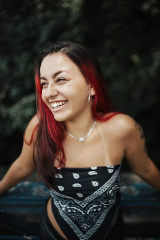 woman smiling in her bathing suit looking down