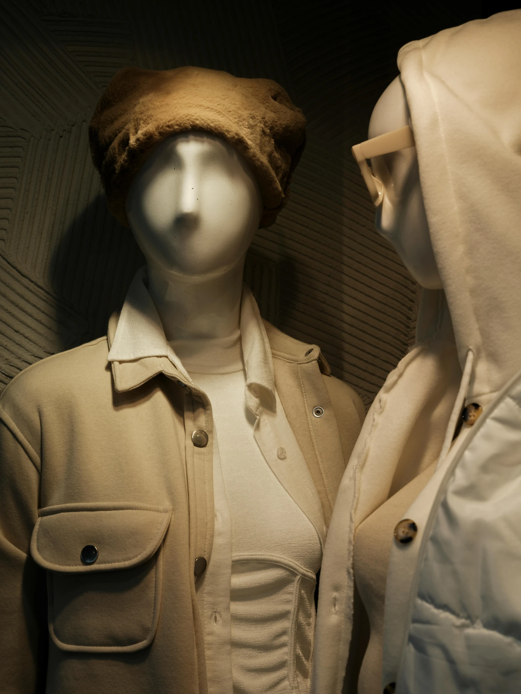 two mannequins standing next to each other