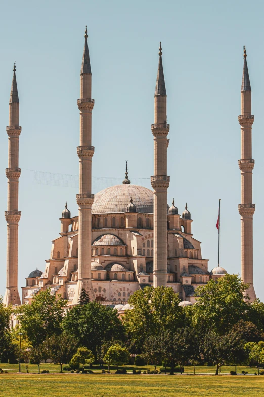 a picture taken from the ground looking at a large building with two towers