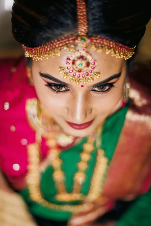 a woman is posing for the camera wearing an orange and green outfit