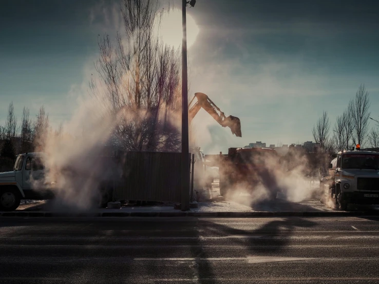 a truck that is spraying out steam on the ground