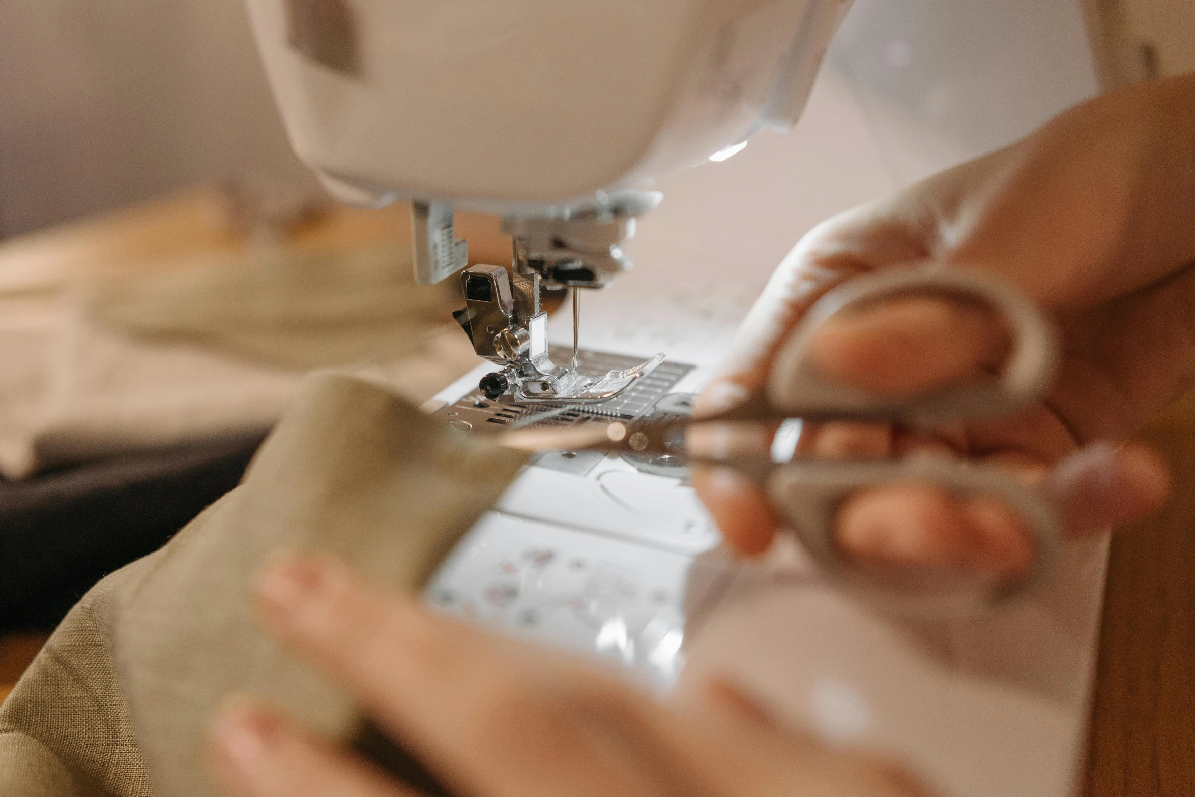 a person working on sewing fabric