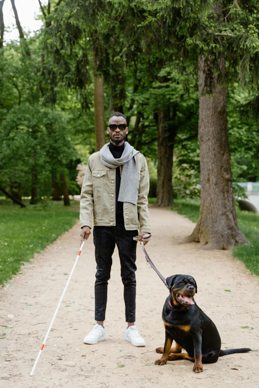 a man on a trail with his dog