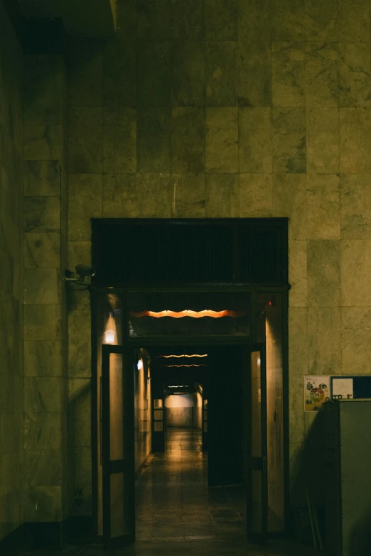 the entrance to the main entrance to a building at night