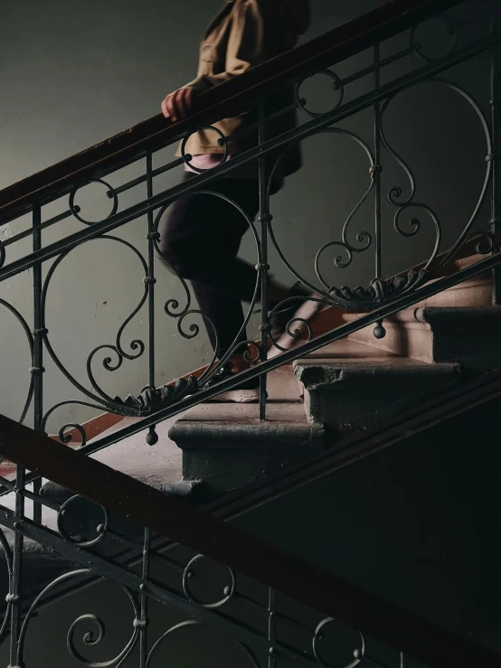 man sitting on the edge of a stair railing