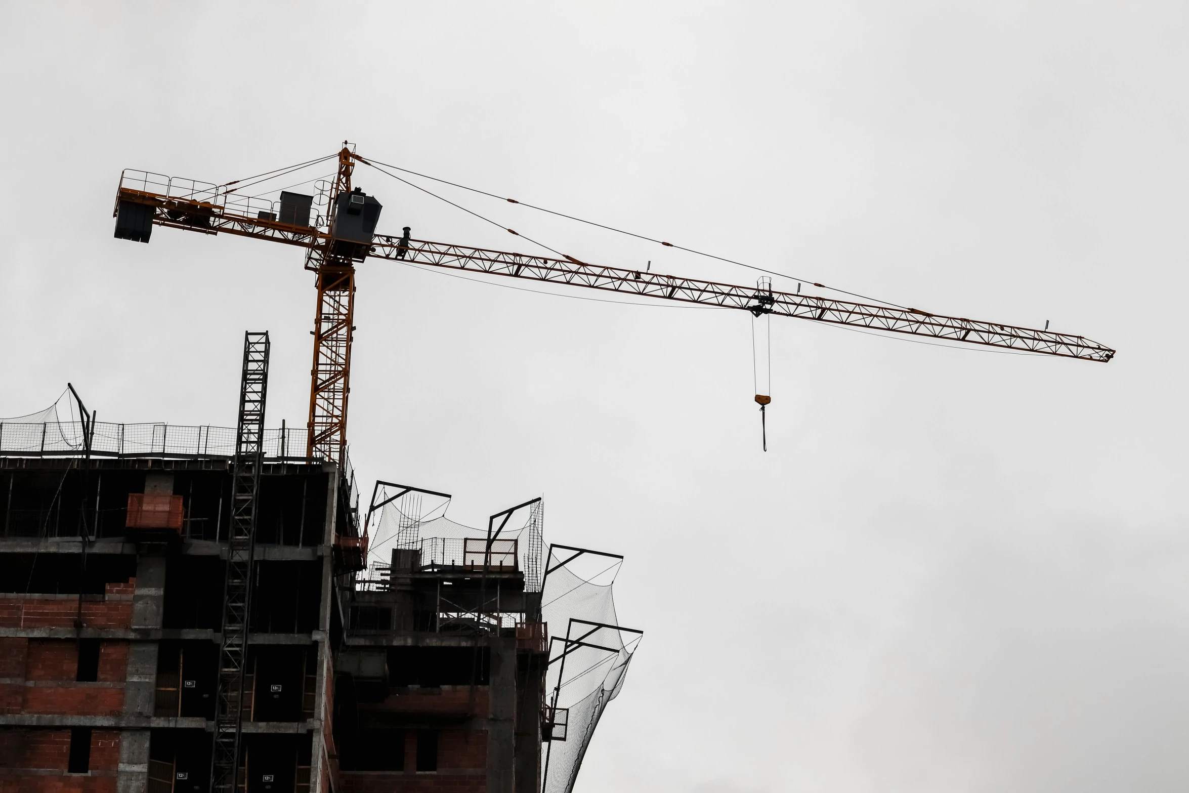 a crane is seen next to a building under construction