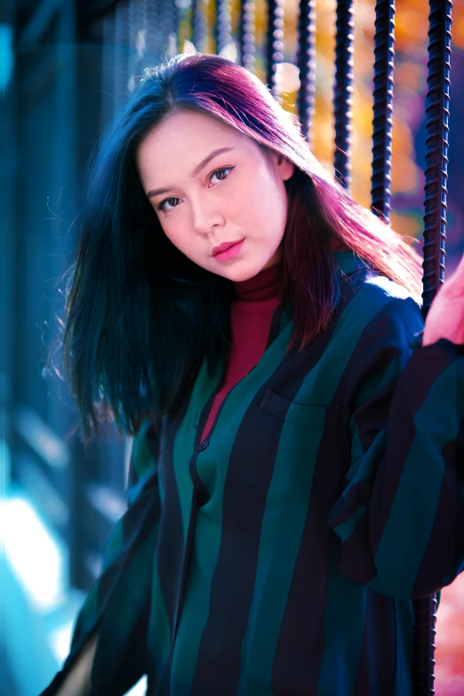 a young woman with long, straight hair wearing a  shirt