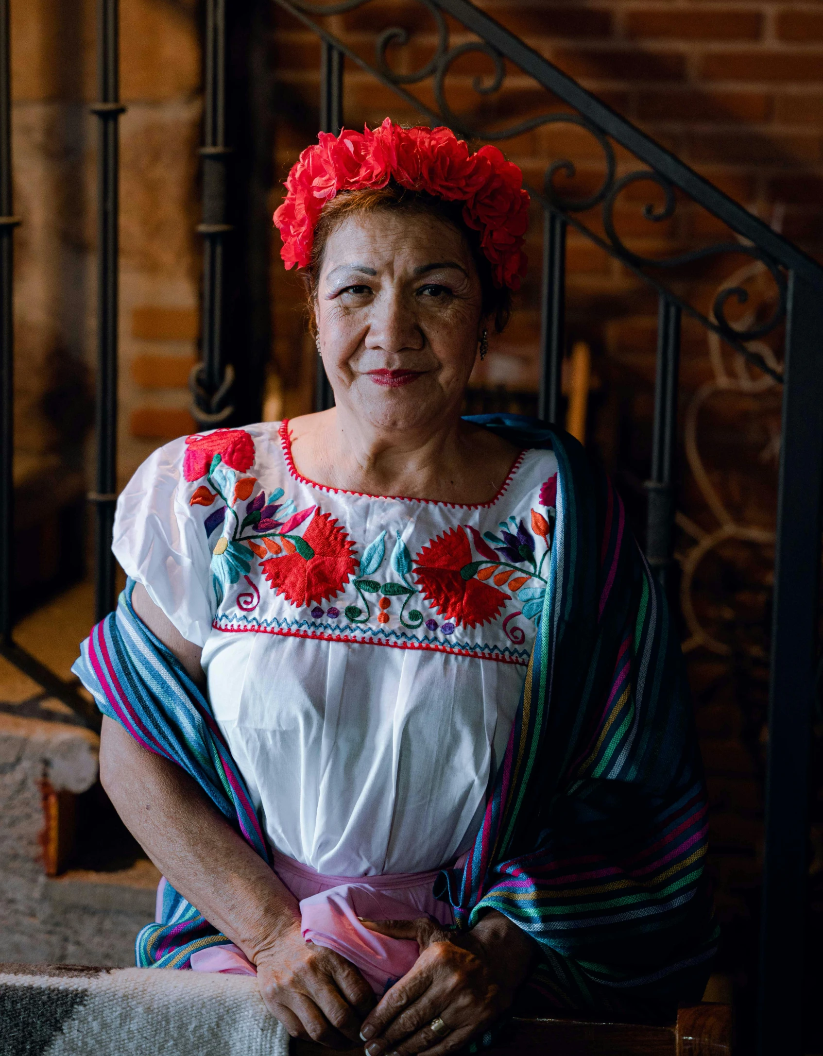 an elderly lady sitting on the steps