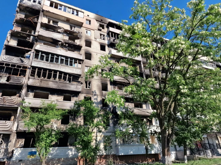 a big building next to some trees