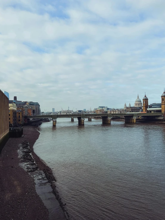 two buildings sitting on top of a river side