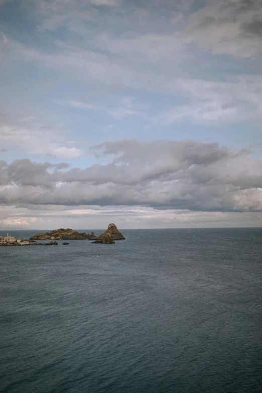 a large body of water with a small island in the distance