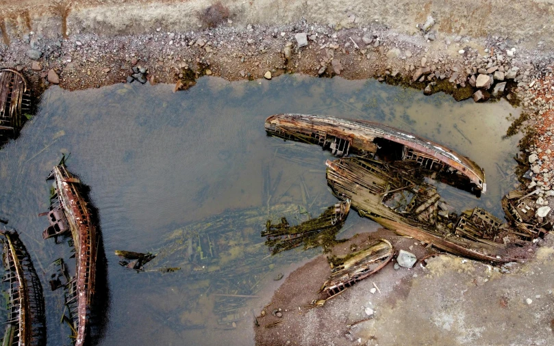 an old boat is partially submerged in the water