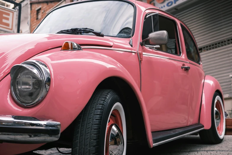 a close - up of a pink classic beetle