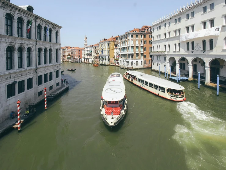 a water bus that is sitting in the middle of a waterway