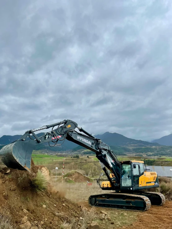 a digger is working to remove dirt from the ground