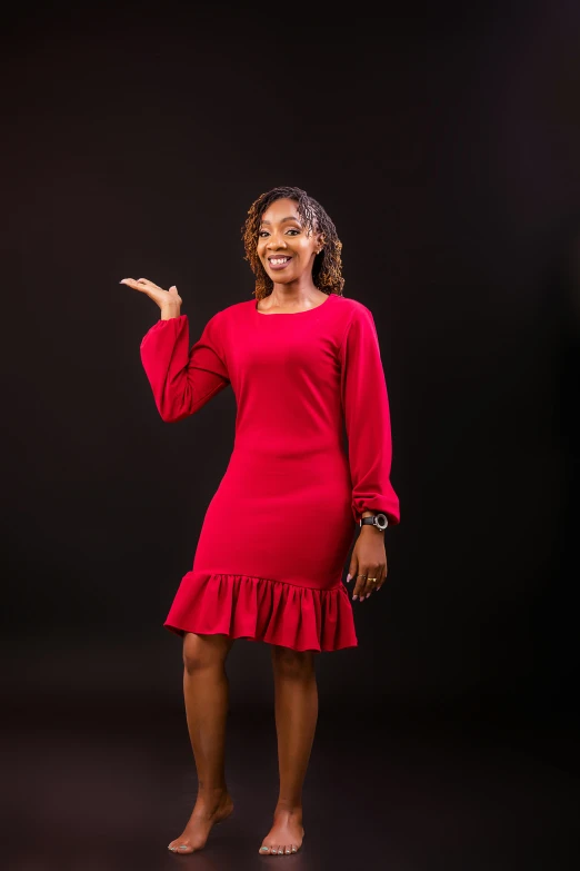 a woman in red dress posing for a po