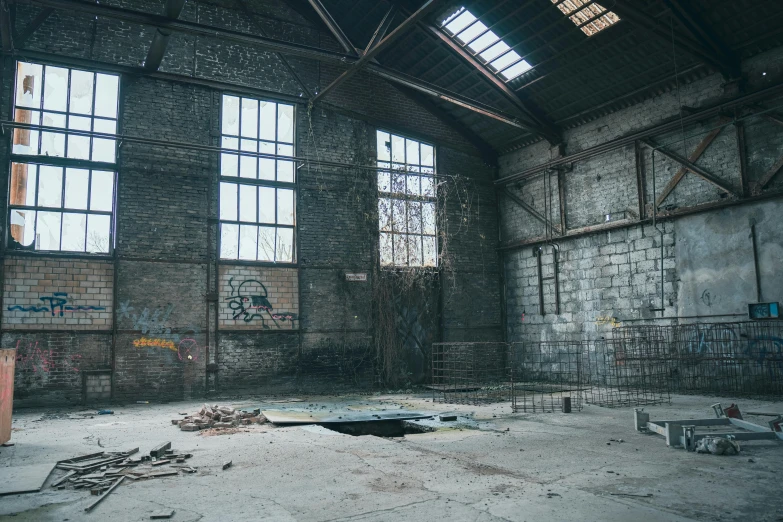 a run down building with multiple windows and broken metal