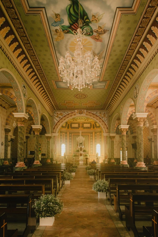 a very long room with a chandelier hanging from the ceiling