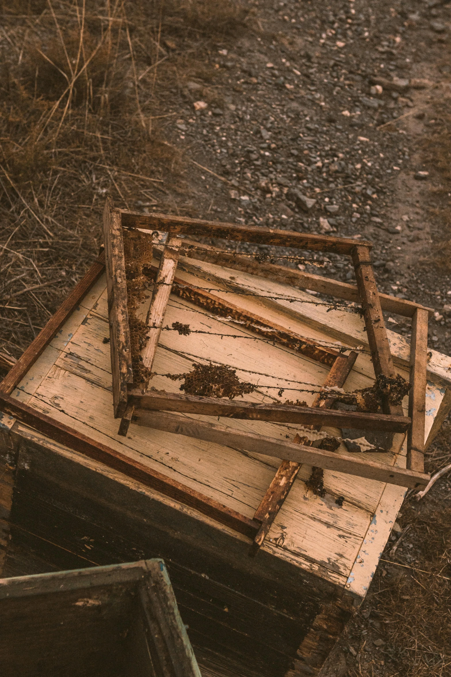 two rusty objects are sitting in an abandoned room