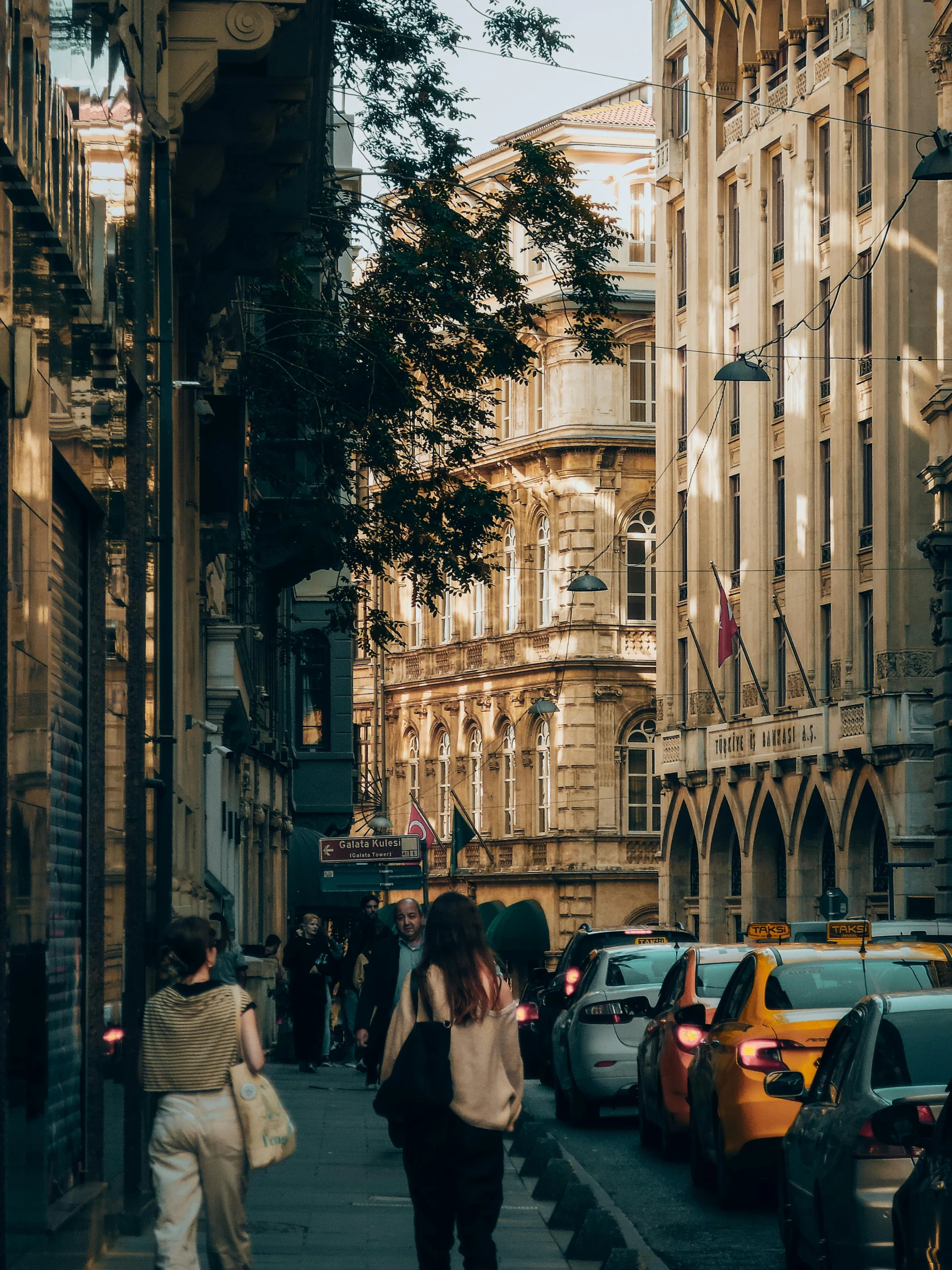 a city street that has a building with lots of windows