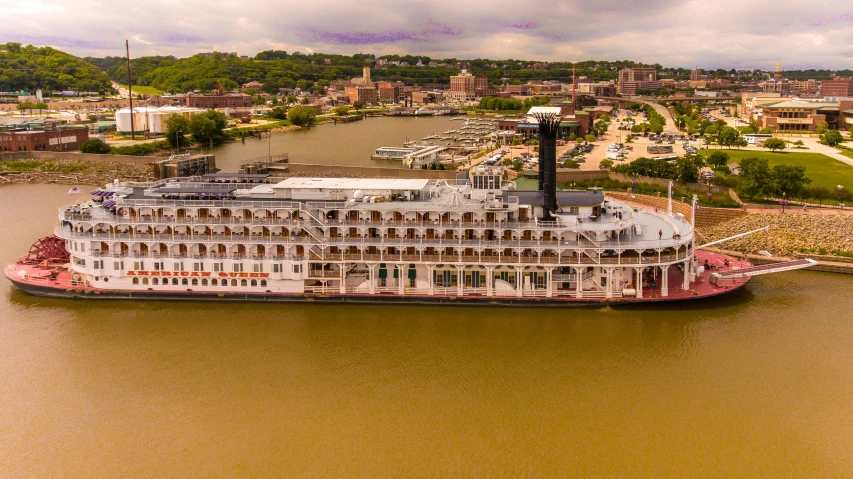 a cruise ship is on the water near the shore