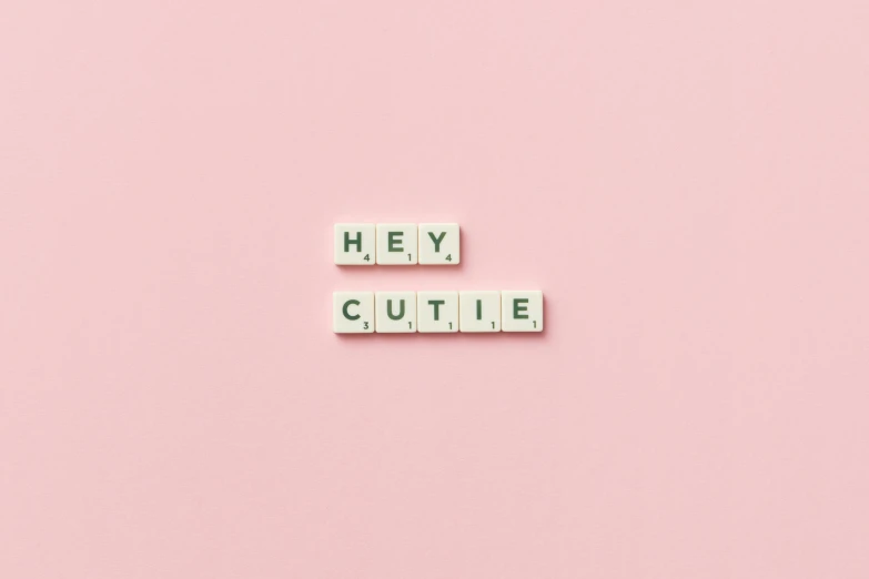 the words hey cutie spelled out on scrabble blocks