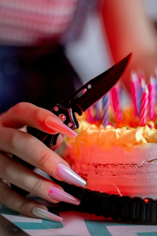 a woman  a cake decorated with icing and candles