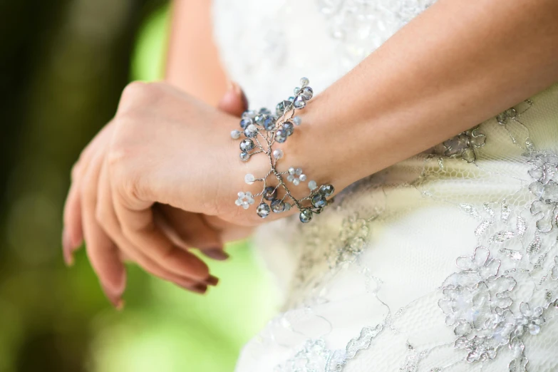 a woman's arm in an elaborate celet