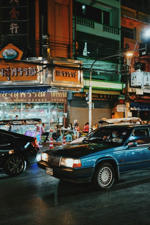 two cars parked on the side of a street