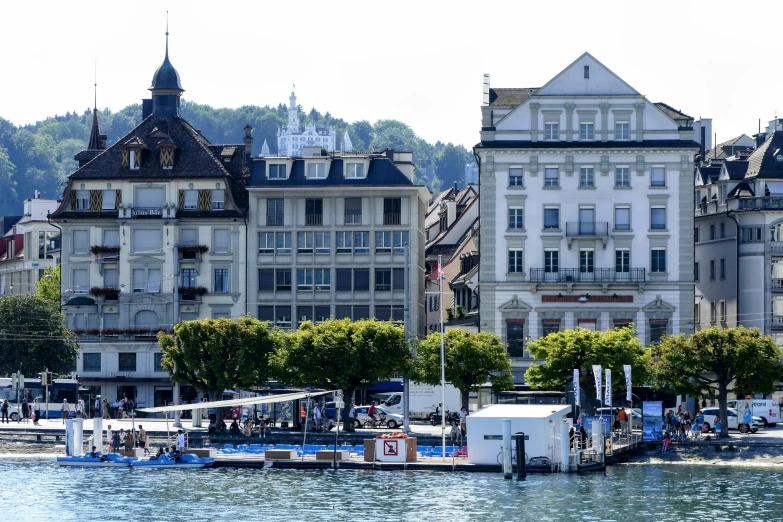 a boat floats in the water near some buildings