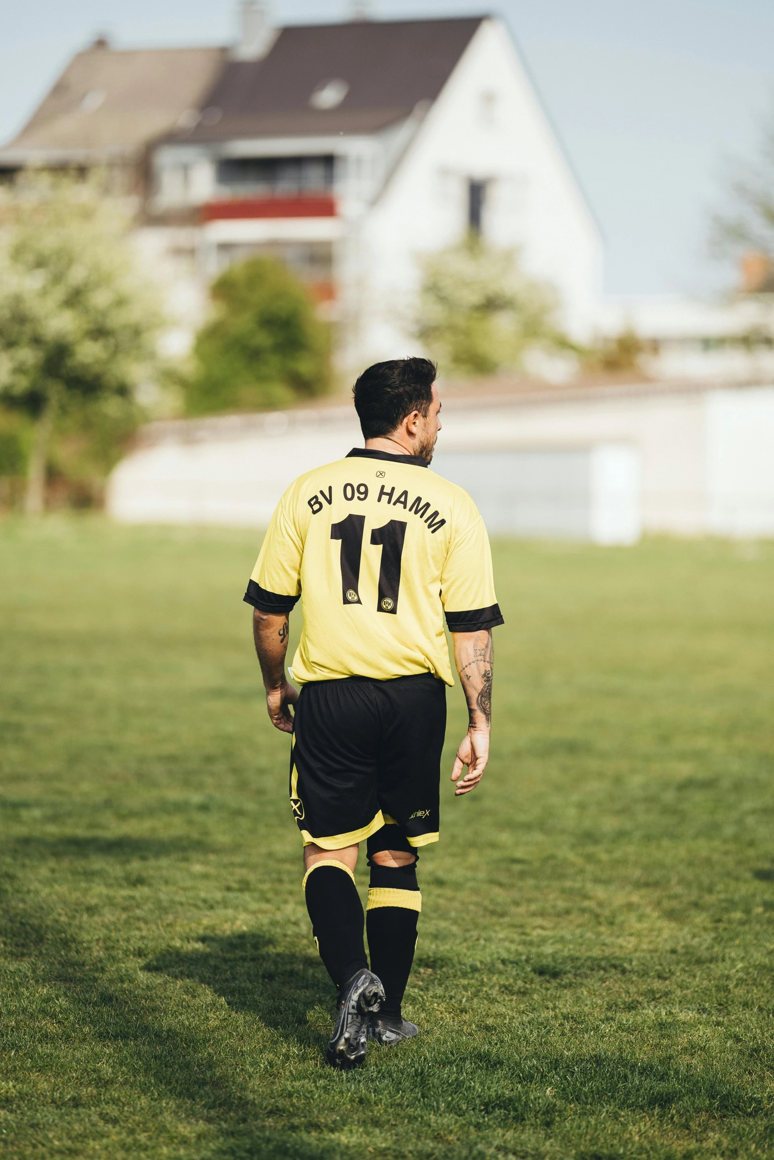 a soccer player is walking off the field