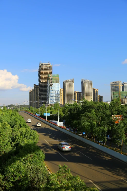 a city view of highway with tall buildings